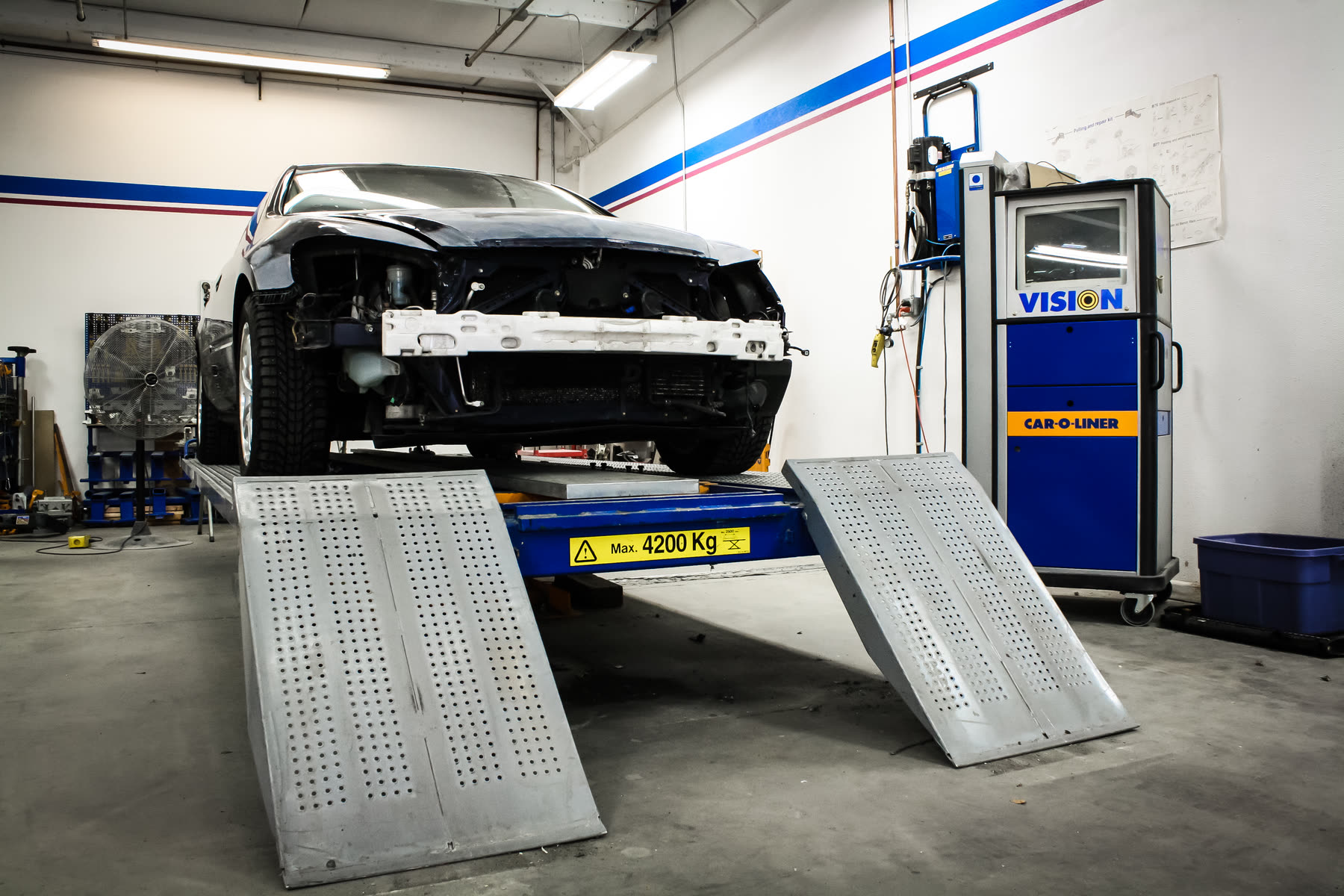 A vehicle on the Car-O-Liner Vision frame rack at California Color.