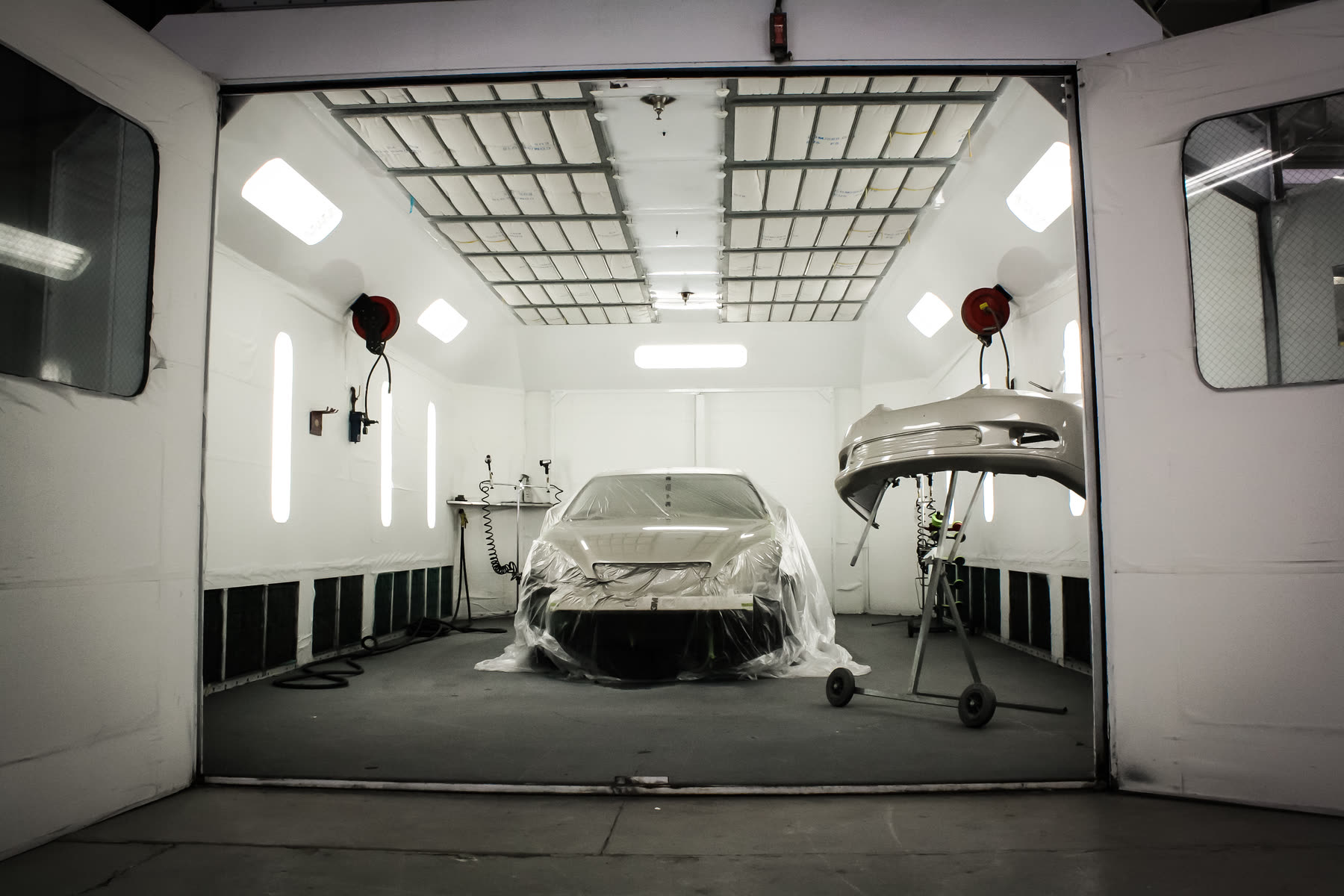 A masked vehicle in the down-draft paint booth at California Color Body & Paint in Chico.